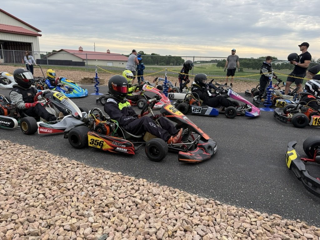 The Moshe Motorsports kart fleet lined up on the grid